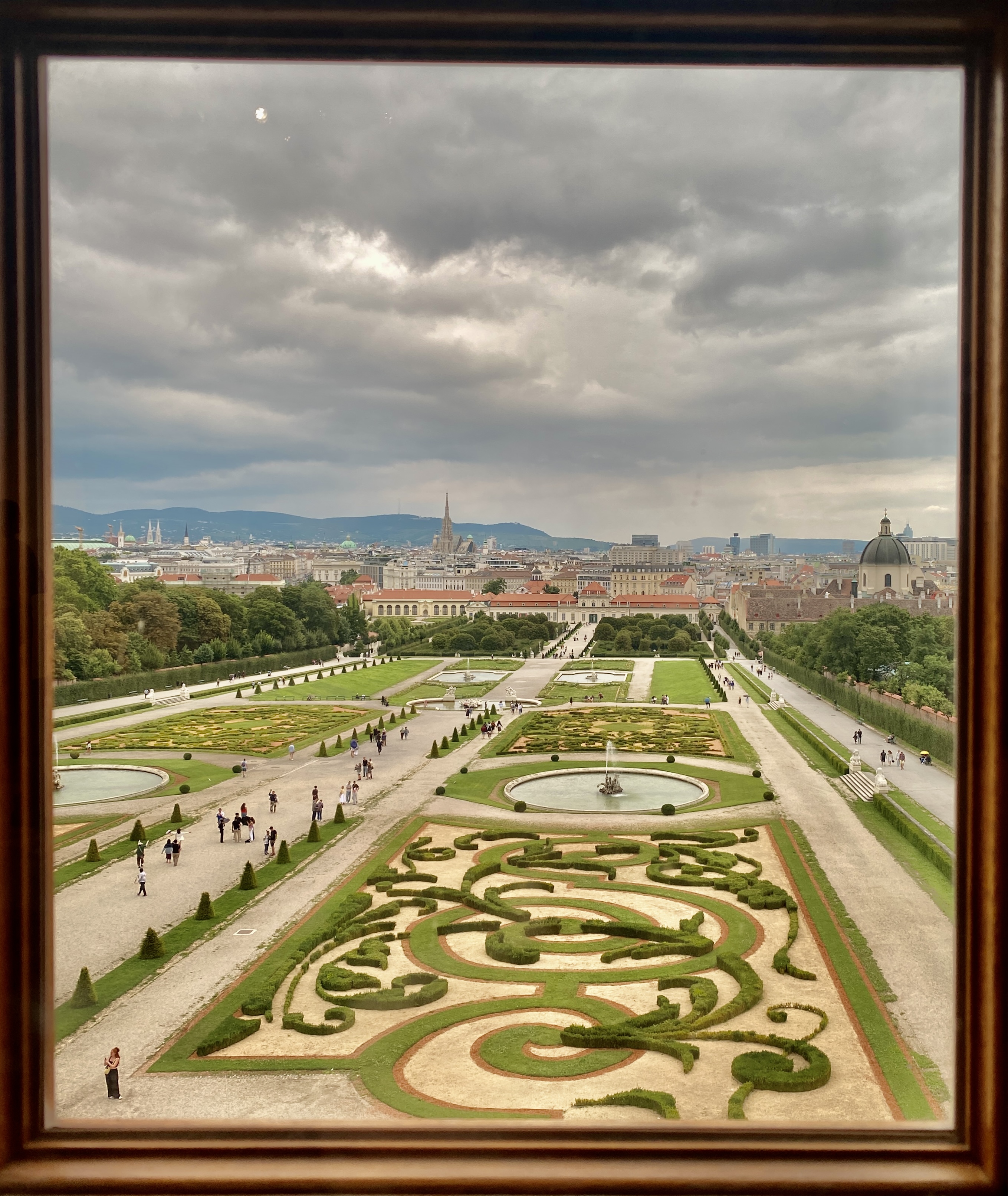 A view across a manicured garden from a second-storywindow